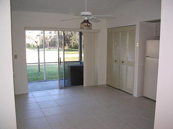 Entrance view to eat in kitchen with view of pool.