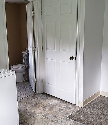 Open door to bath & door to attic