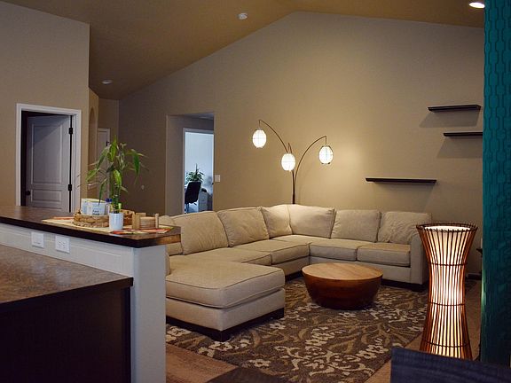 Living room from dinning room. Laundry and garage entry.