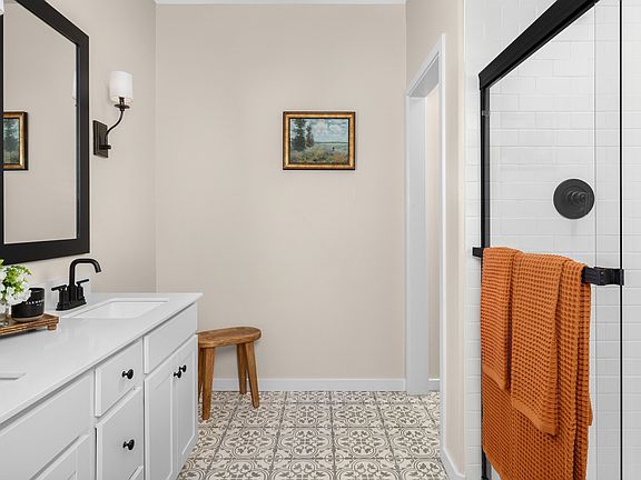 Primary bath with glass shower enclosure