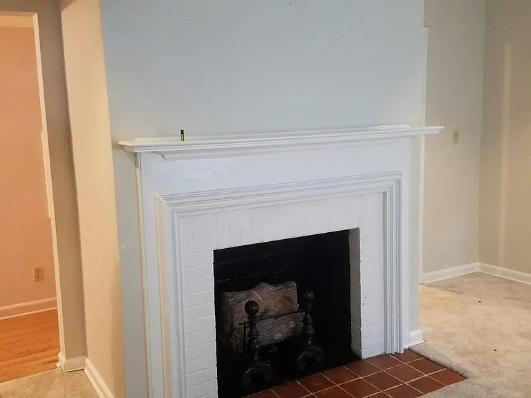 Cozy living room with brand new carpet, gas fireplace.