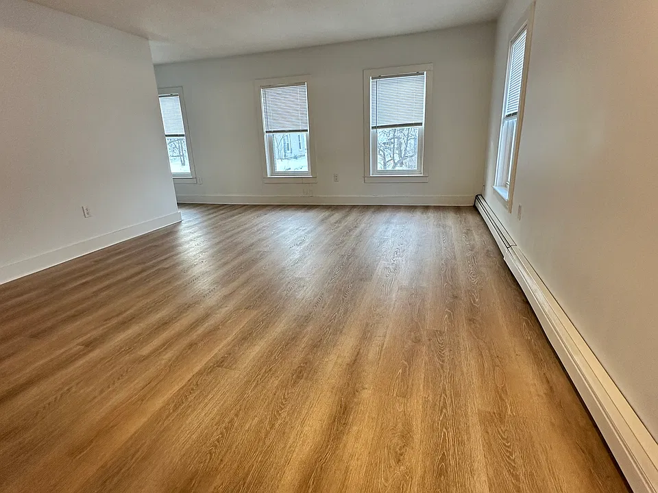 Large open living room with lots of natural light.