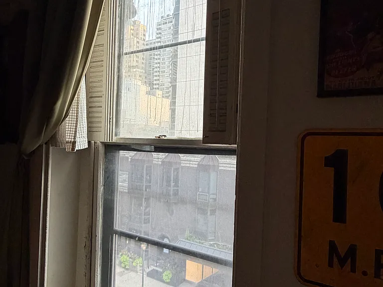 Extra large windows facing Walnut St. with built-in shutters. Amazing views!