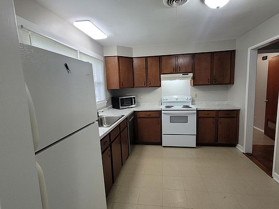 Kitchen with new dishwasher with stainless tub. New sink, faucet and garbage disposal and countertops.