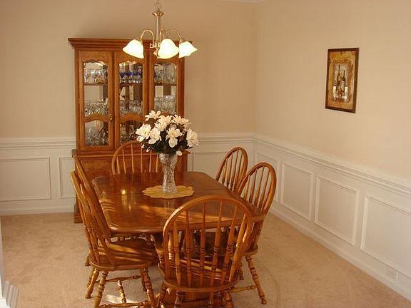 Formal dining with chair rail and wainscoting.
