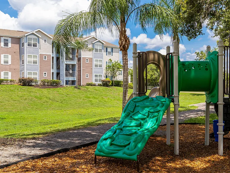 With palm trees and plenty of green space, our community playground is a fun and refreshing spot for kids to climb, slide, and explore.