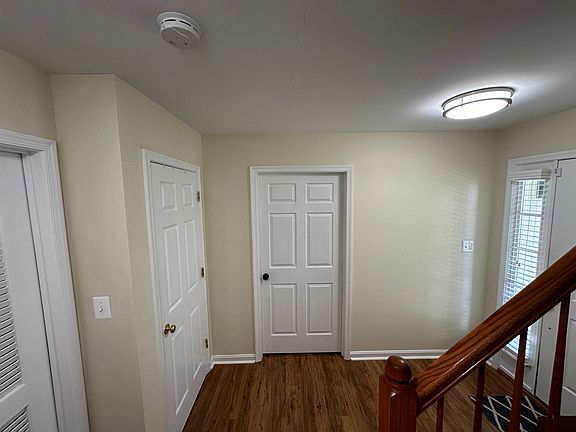 front door entrance area with door to private room access