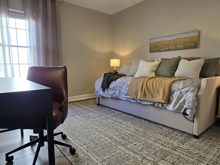 Multi-purpose office offering a fully equipped workspace and a guest trundle bed for added flexibility.