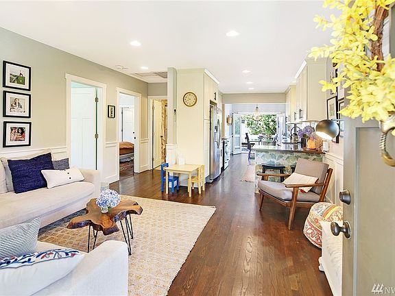 The Rich Hardwood Floors run throughout the Kitchen & Dining Rooms and into both of the Upstairs Bedrooms. Remodeled in 2015 the Craftsman Door Details & Period Wainscoting celebrate the Homes' 1917 History. 