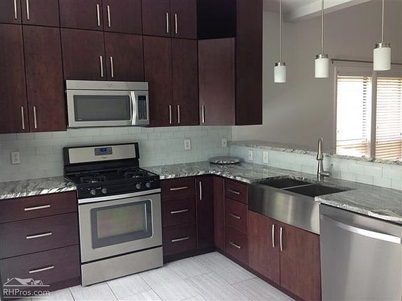 Updated kitchen with stainless appliances and granite counte