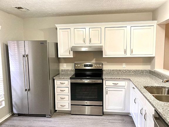 Updated Kitchen with granite countertops and stainless steel appliances
