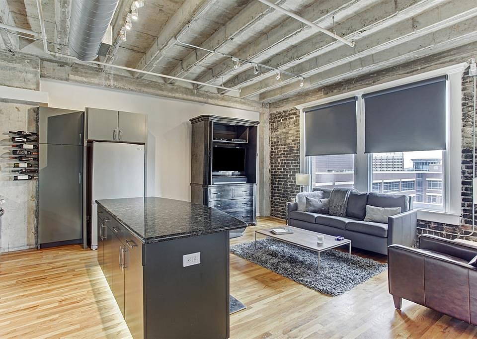 True loft style living with exposed brick walls, open cement ceilings and exposed duct work. Many updates have been made to this unit. Notice the under cabinet LED lights.