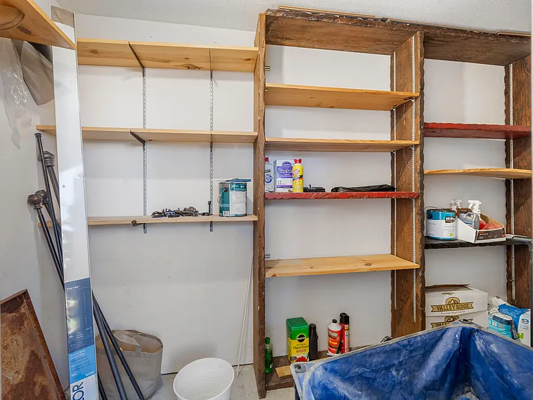 The unit includes a private storage room with direct access from the living room patio, providing convenient extra storage space.