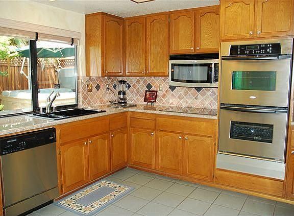 Granite counter tops with tumble stone back splash, double ovens and more!