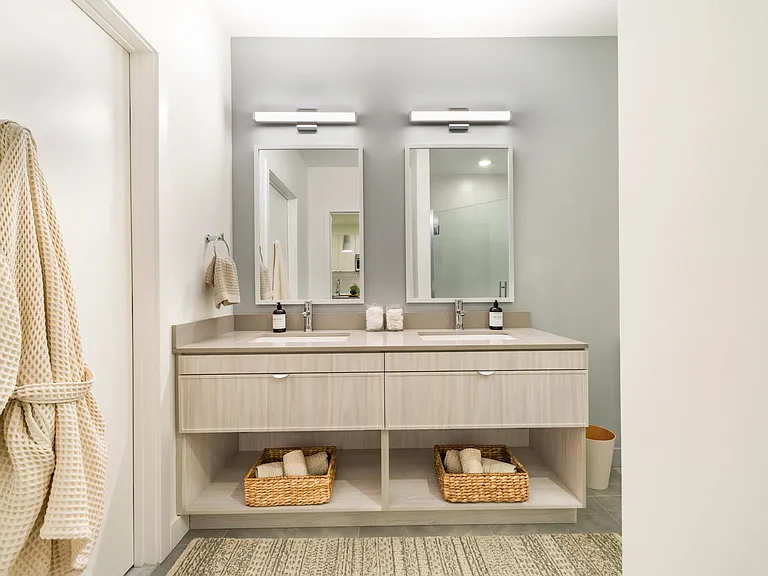 A double vanity with clean finishes, ample storage, and space to get ready with ease.