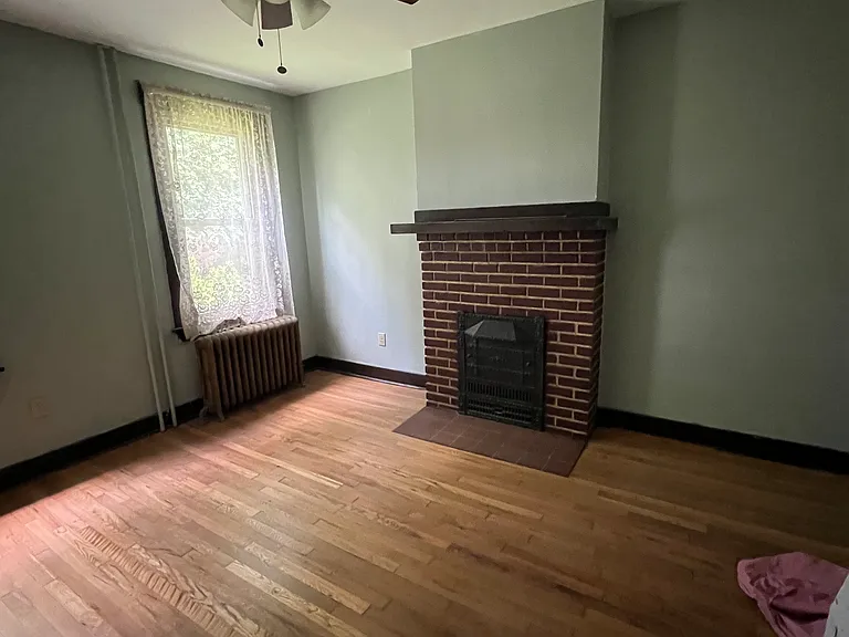 Bedroom - non-functioning fireplace.