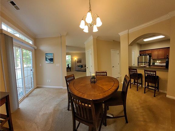 Dining Room with a slider to the enclosed patio with a shed.