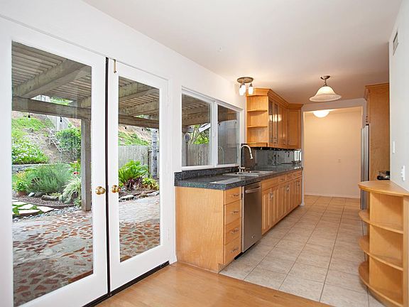 French doors lead to covered patio.