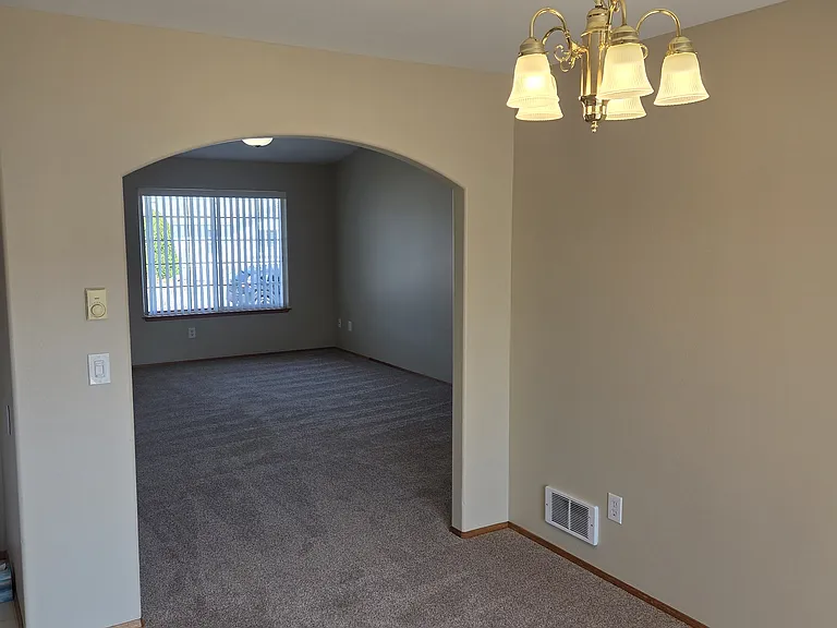 View from the dining room near the sliding patio door towards the living room.