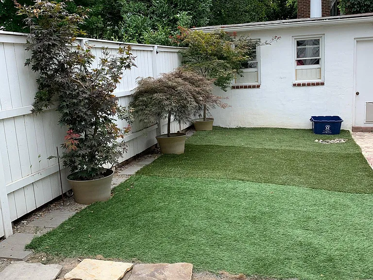Backyard with flagstone patio and oversized shed