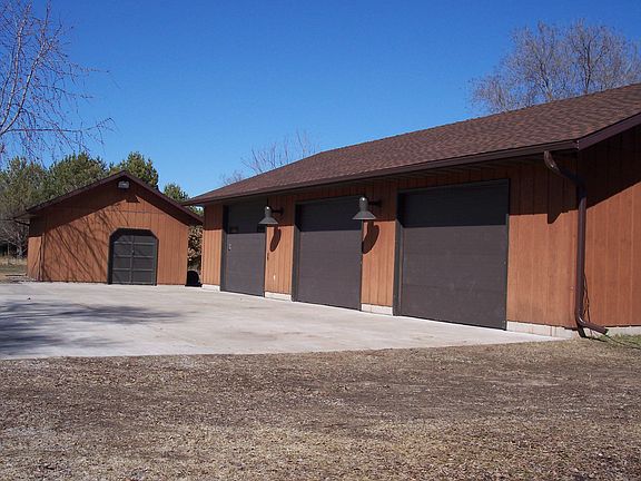 Detached 3 stall garage and shed