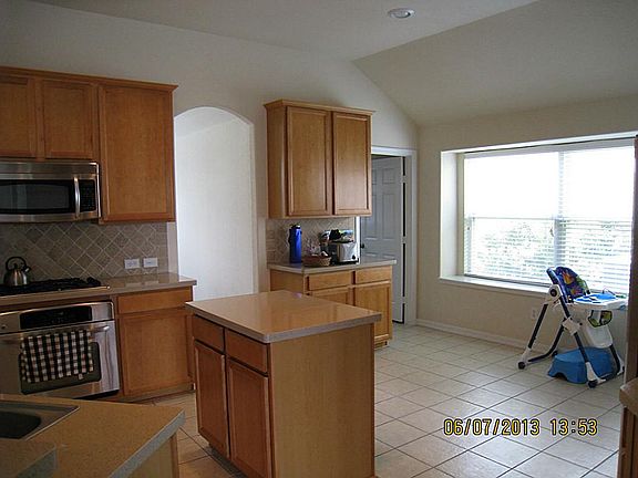 Another view of kitchen and breakfast area with window seat and double window for plenty of light!
