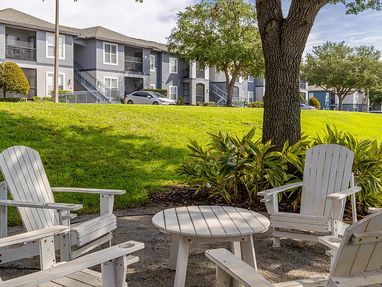 Unwind beneath the shade and enjoy peaceful moments in our Adirondack-style seating areaperfect for catching up with friends or relaxing solo.