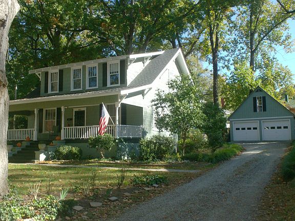view with driveway and 2-car garage and bonus room