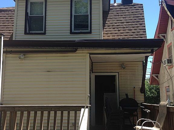 Back of house with deck