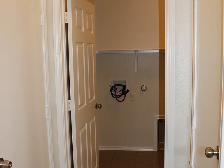 Utility room from entryway (door to garage on left)