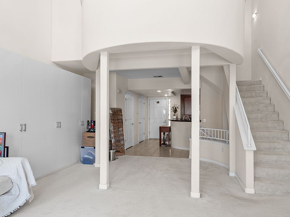 Living Room with Stairs going up to Loft