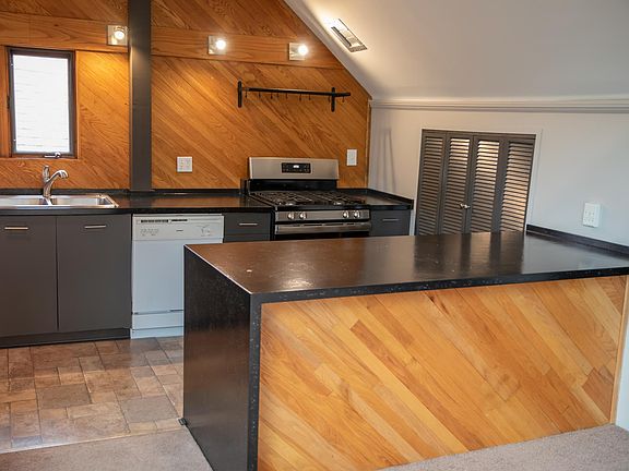 Kitchen with all appliances, including a gas stove.