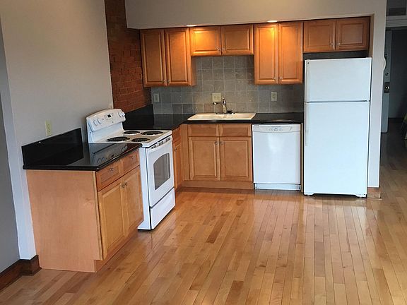 Fully equipped kitchen with dishwasher and disposal.