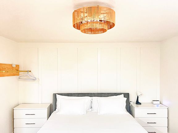 Updated with small ceiling fan/light fixture and bedside drawers.