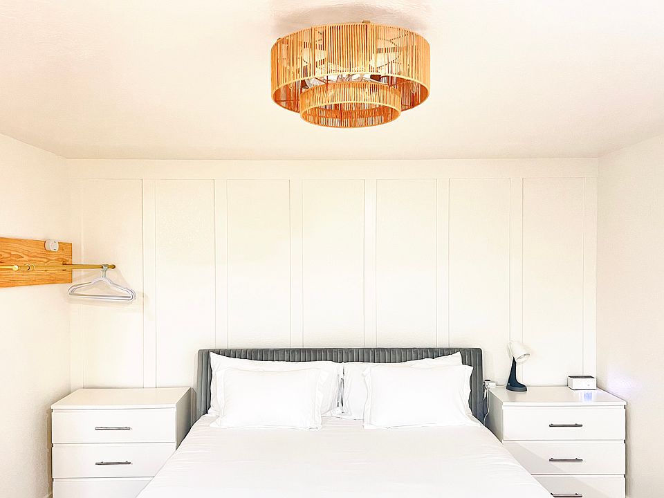 Updated with small ceiling fan/light fixture and bedside drawers.