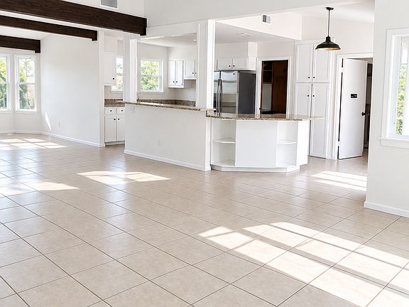 Open living and kitchen. Freshly painted.