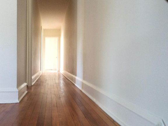 Hallway to back bedrooms and bath
