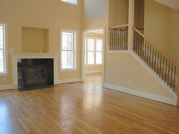 Family room hardwood, wrought iron staircase.
