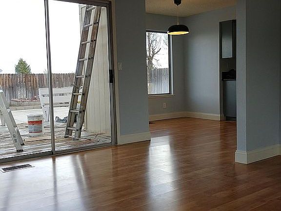 Living room into dining room (you can see the painter is wor