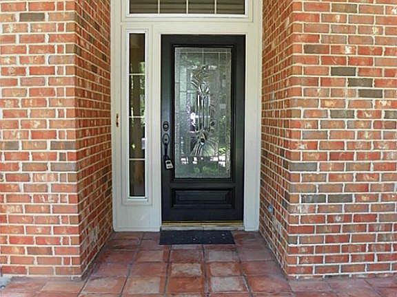 Open the front door and step inside.