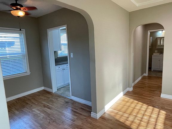 View of the hallway leading to bedroom on the right of the hallway and bathroom at the end of hallway