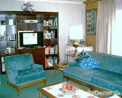 living room
						:
						on right is one of the 6 windows in front of the house