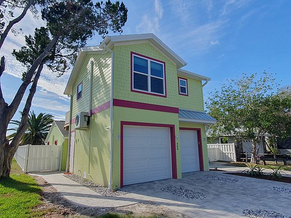Apartment is above garage. You enter through garage. Structure behind garage is no longer there.