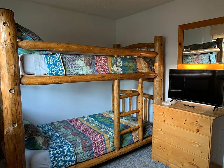 Full bunk bedroom with SmartTV
