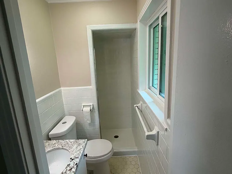 Primary attached bathroom fully reglazed tile
Bluetooth light with speaker