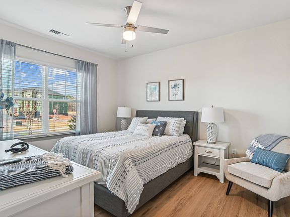 Oversized Bedrooms with Wood Inspired Flooring