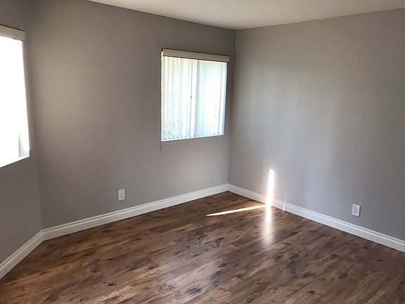 Master Bedroom with View and wooden floor