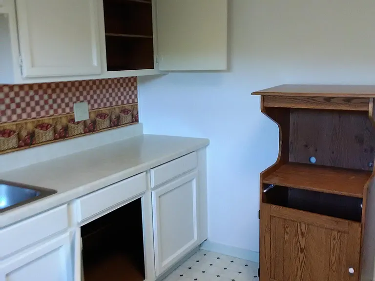 Clean cabinets inside and out. With a microwave stand.