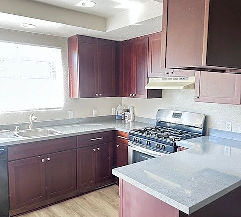 "Well-maintained kitchen with practical layout."