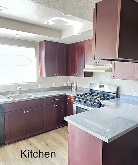 "Well-maintained kitchen with practical layout."